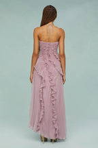 Back view of lilac ruffle halter dress with open straps and spiral tiered skirt