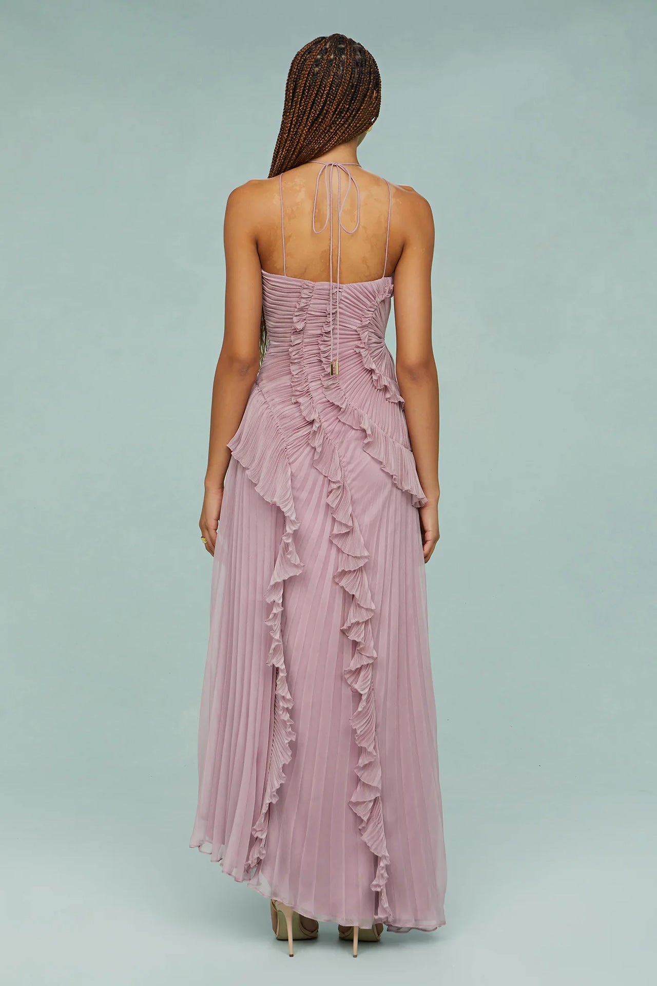 Back view of lilac ruffle halter dress with open straps and spiral tiered skirt