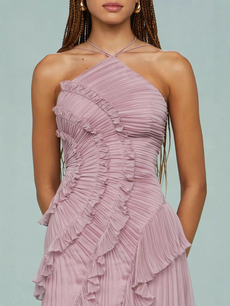 Close-up of lilac ruffle halter dress with spiral pleated bodice and layered ruffles