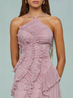 Close-up of lilac ruffle halter dress with spiral pleated bodice and layered ruffles