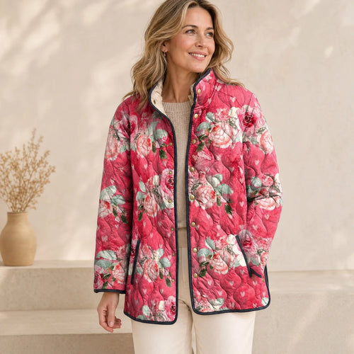 Pink floral quilted jacket with black trim, snap-front and stand collar detail