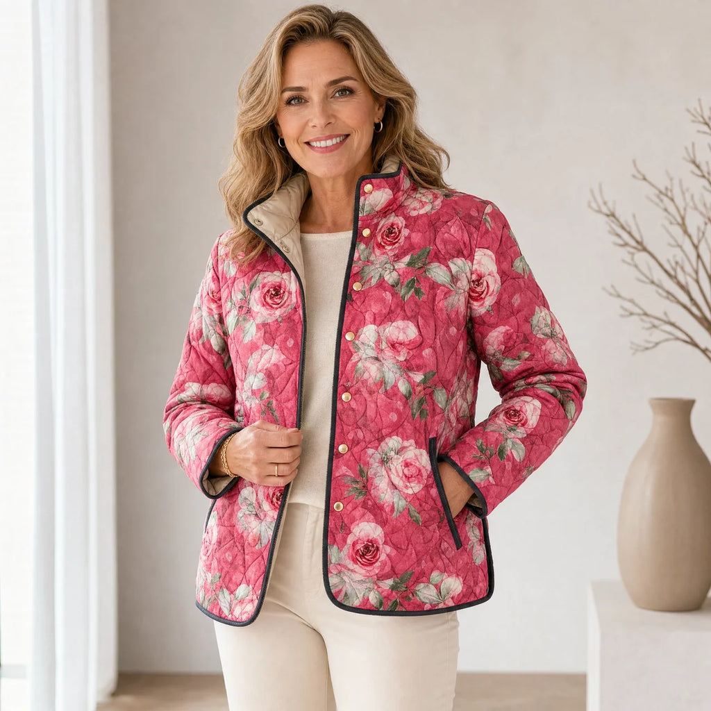 Pink floral quilted lightweight jacket worn by model, snap-front with stand collar