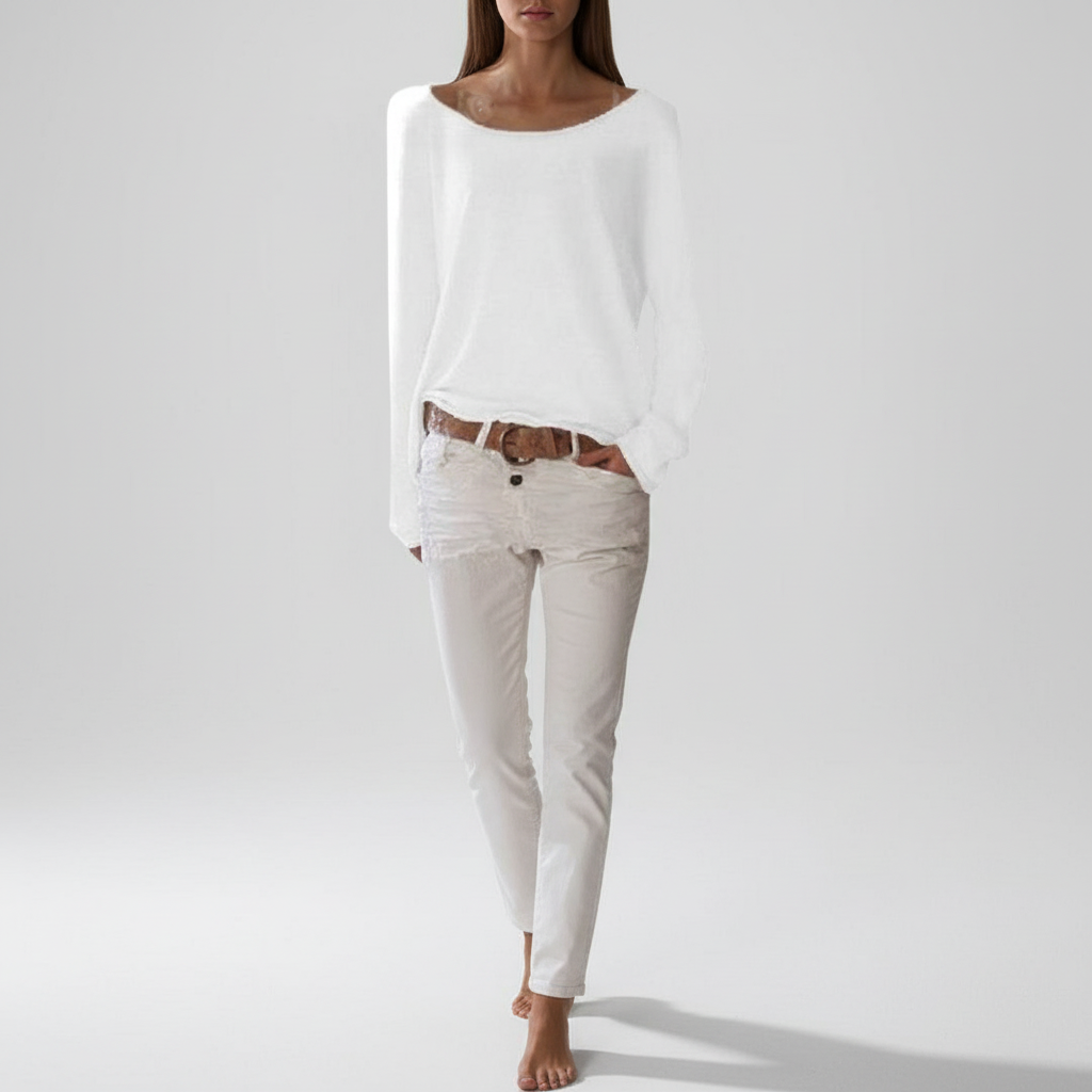 White boat-neck knit sweater with long sleeves and relaxed draped fit