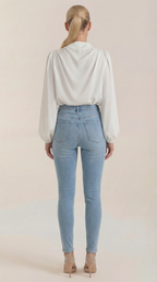 White draped long-sleeve blouse with back drape and gathered shoulders