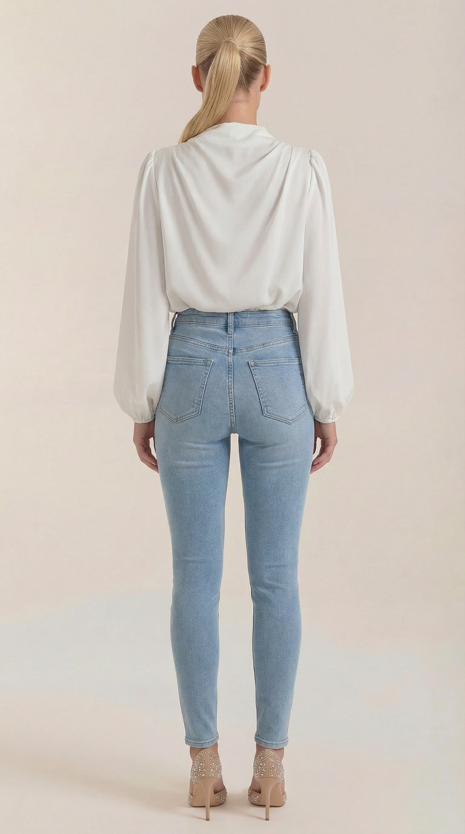 White draped long-sleeve blouse with back drape and gathered shoulders
