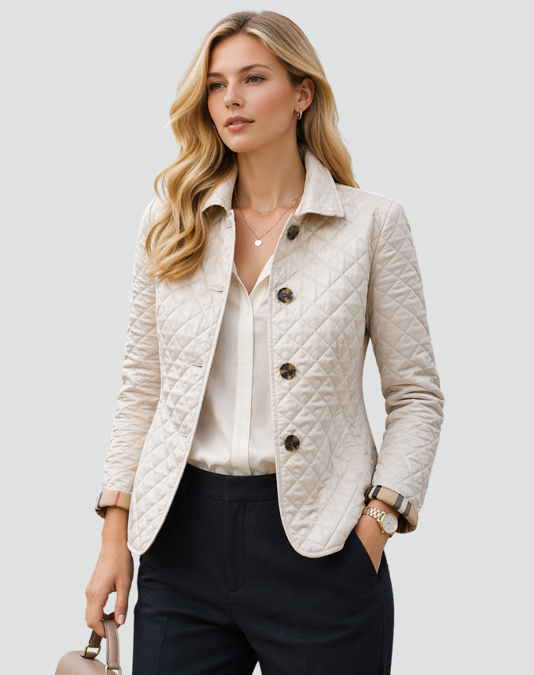 White quilted jacket with button front and diamond stitching, lightweight padded