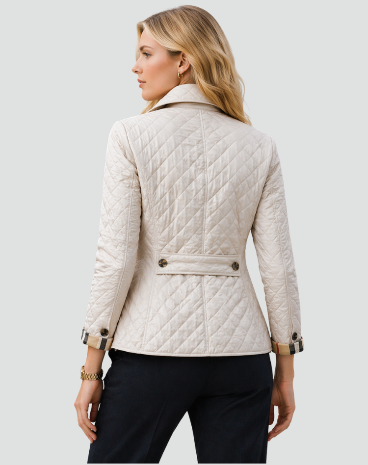 Ivory quilted jacket with button front, diamond stitching, and belted waist detail