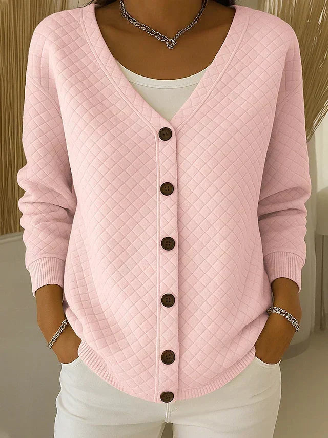 Pink quilted relaxed cardigan sweater with V-neck and button front