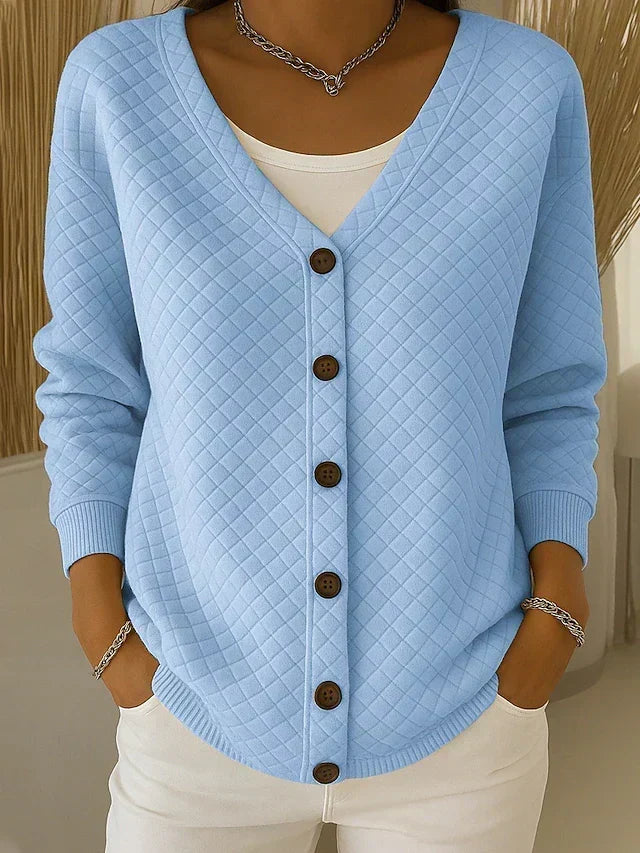 Blue quilted relaxed cardigan sweater with V-neck and button front