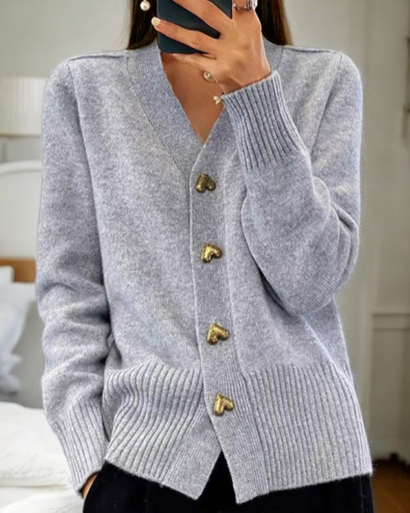 Grey knit V-neck cardigan with gold heart buttons and ribbed cuffs and hem