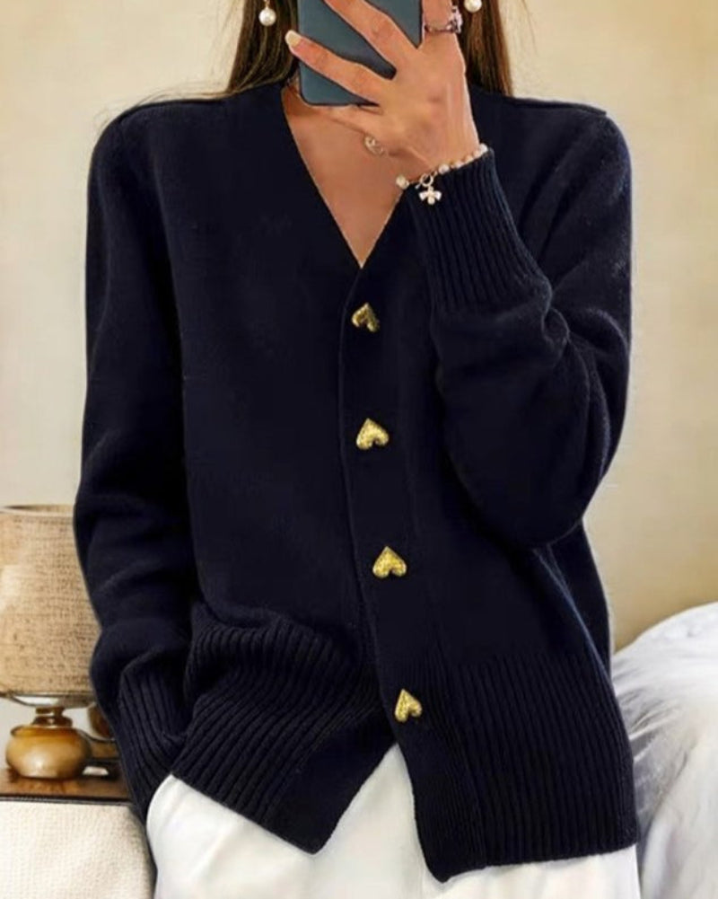Black knit V-neck cardigan with gold heart buttons and ribbed cuffs and hem