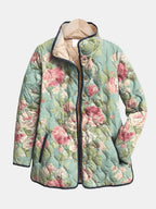 Lightweight quilted floral jacket in teal with pink rose print, black trim, snap buttons