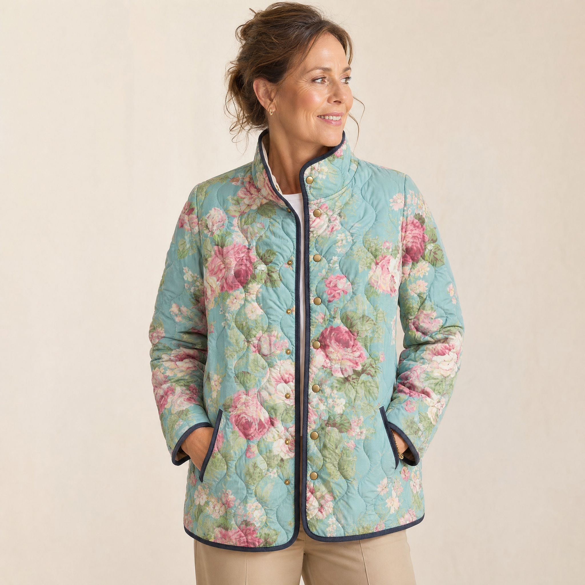 Lightweight quilted floral jacket in teal with pink rose print and black-trimmed stand collar