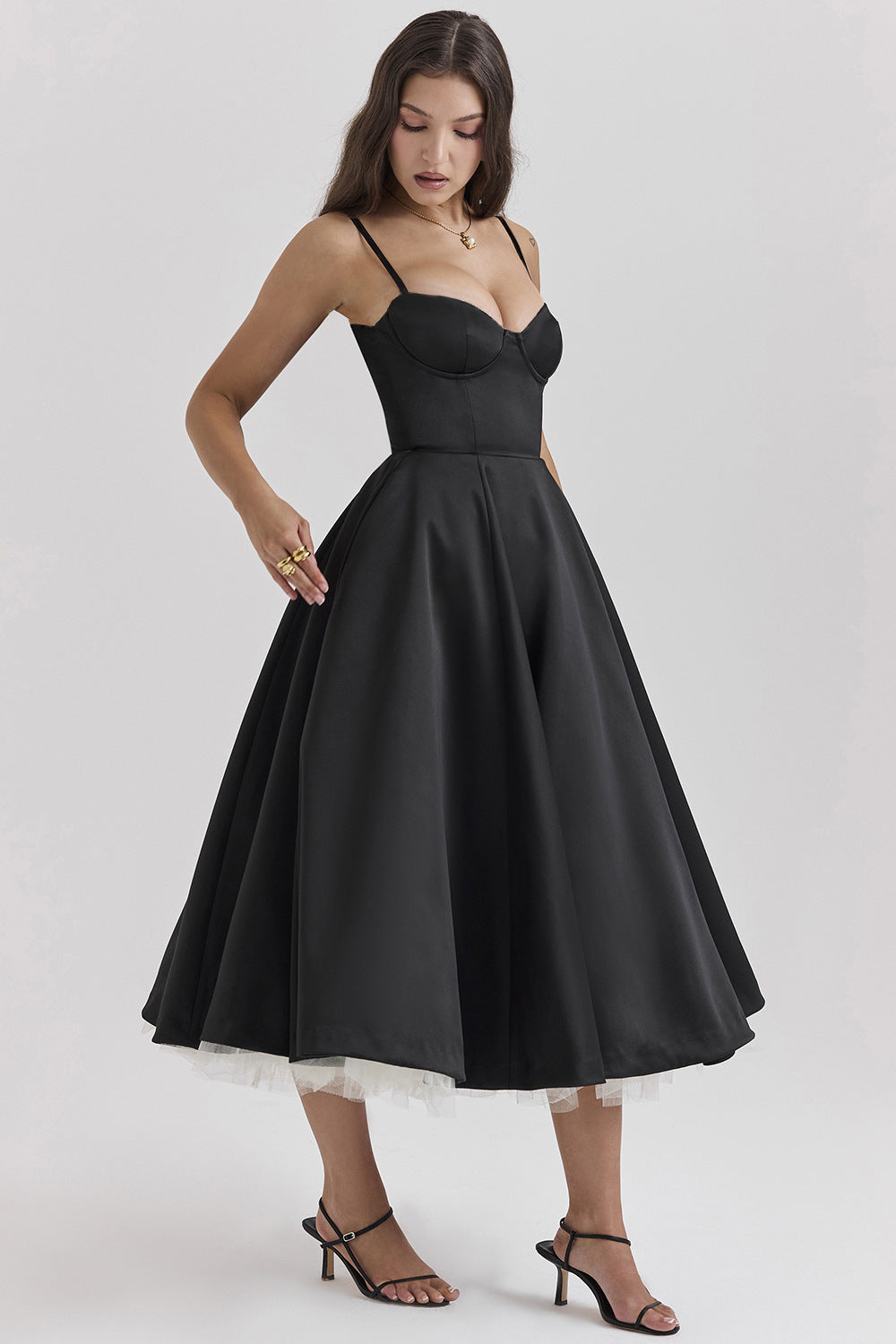 Black bustier midi dress with thin straps and gathered layered tulle skirt