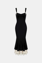Black fitted midi dress with spaghetti straps and layered ruffle fishtail hem