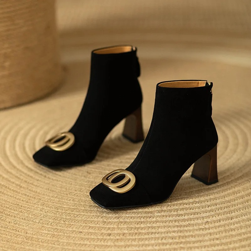 Black velvet ankle boots with square toe, block heel, and gold O-ring buckle detail