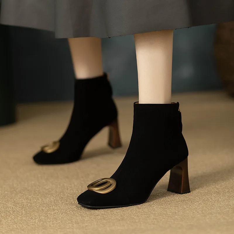 Black velvet ankle boots with block heel and gold O-ring buckle detail