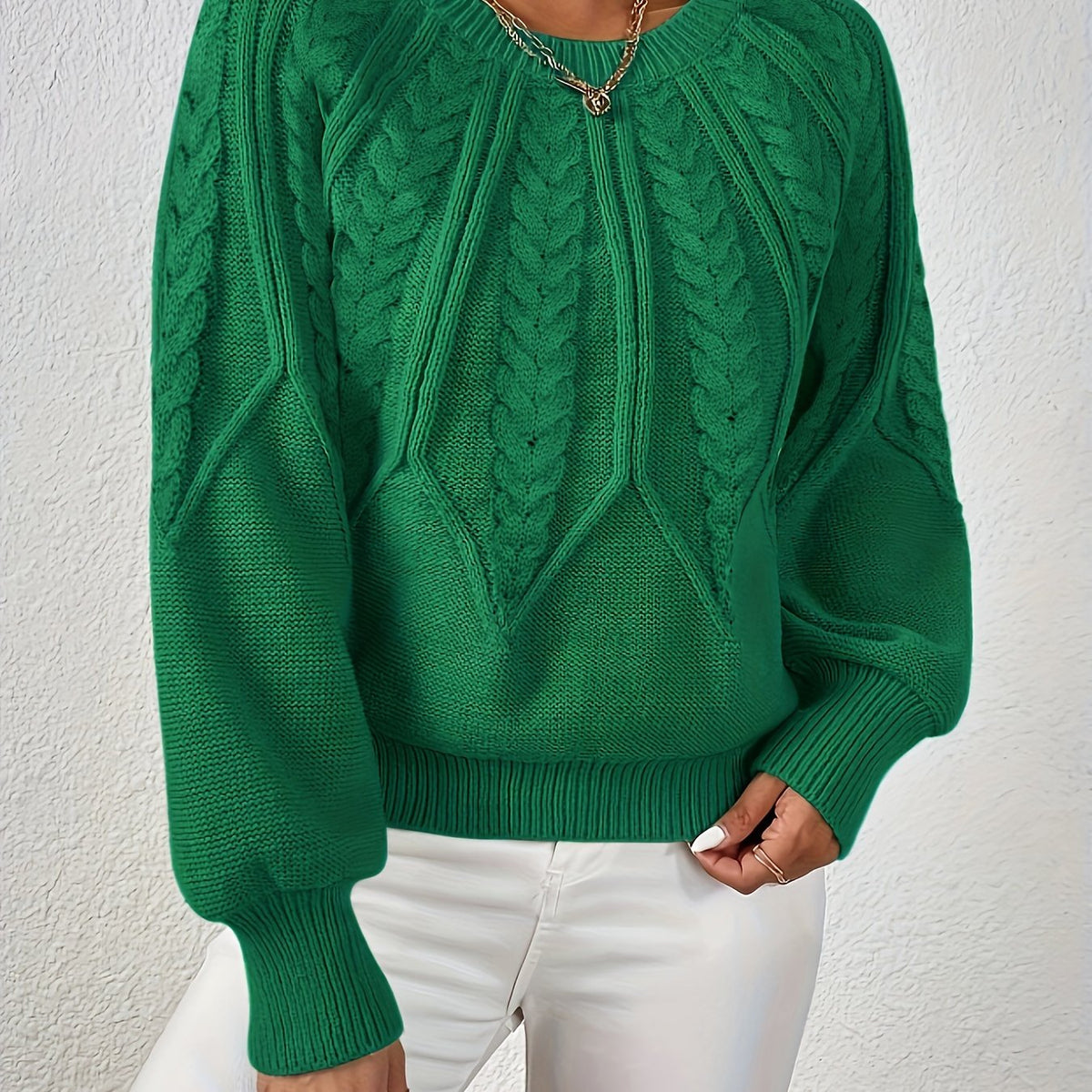 Green cable knit sweater with voluminous sleeves, textured cable diamond pattern, zip neck
