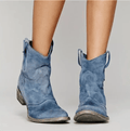 Blue suede western ankle boots with stacked block heel and pull tabs