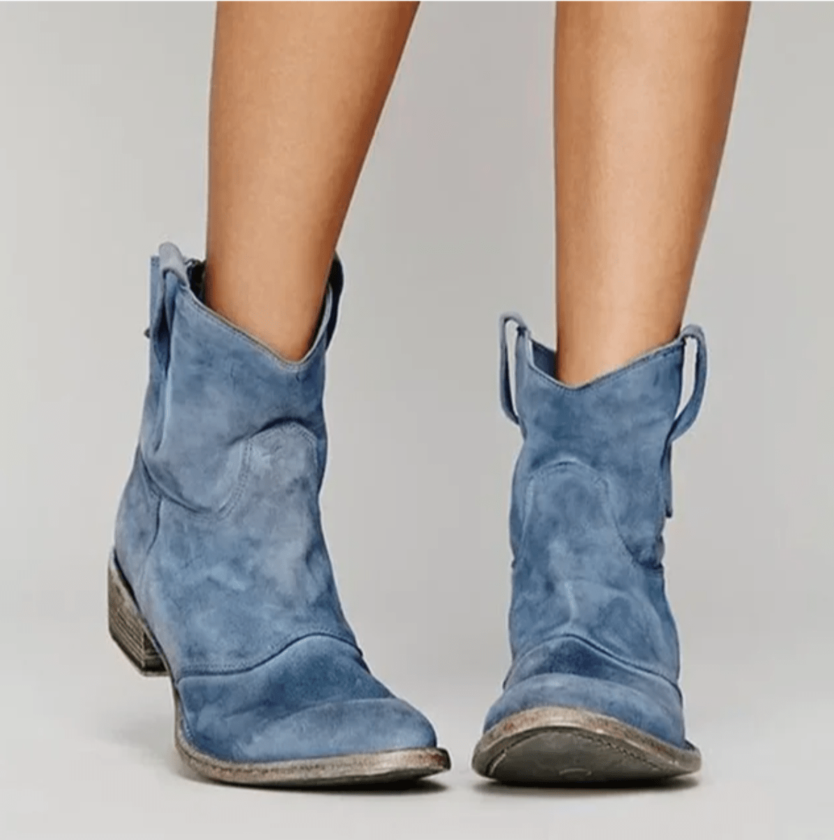Blue suede western ankle boots with stacked block heel and pull tabs