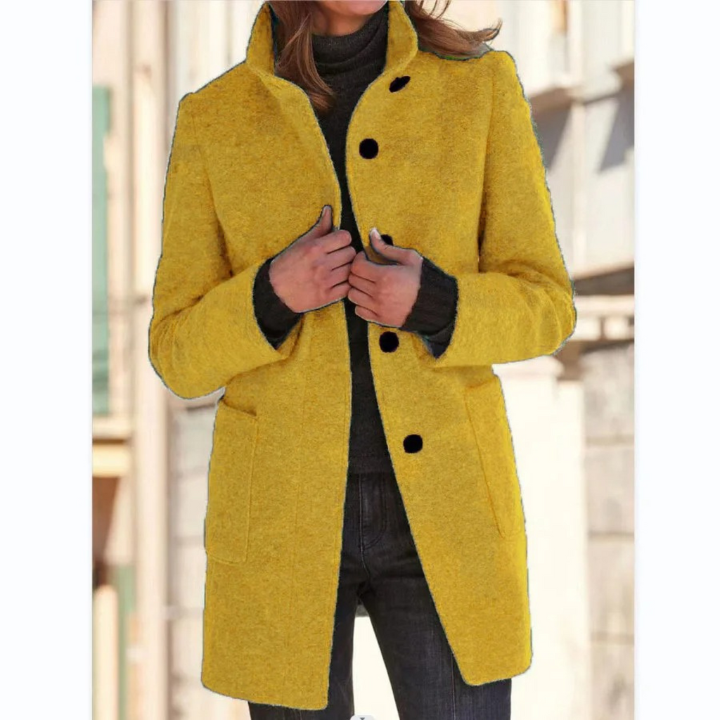 Women’s mustard yellow stand-collar winter coat with button front and side pockets.