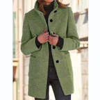 Women’s green stand-collar winter coat with button front and side pockets.