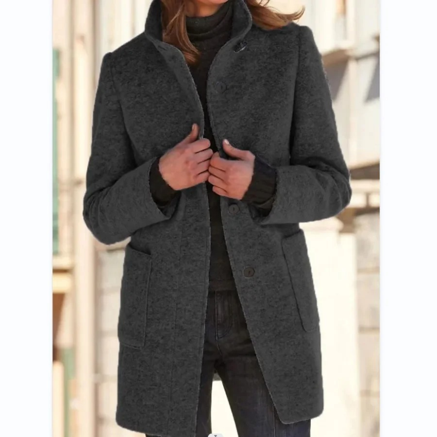 Women’s dark gray stand-collar winter coat with button front and side pockets.