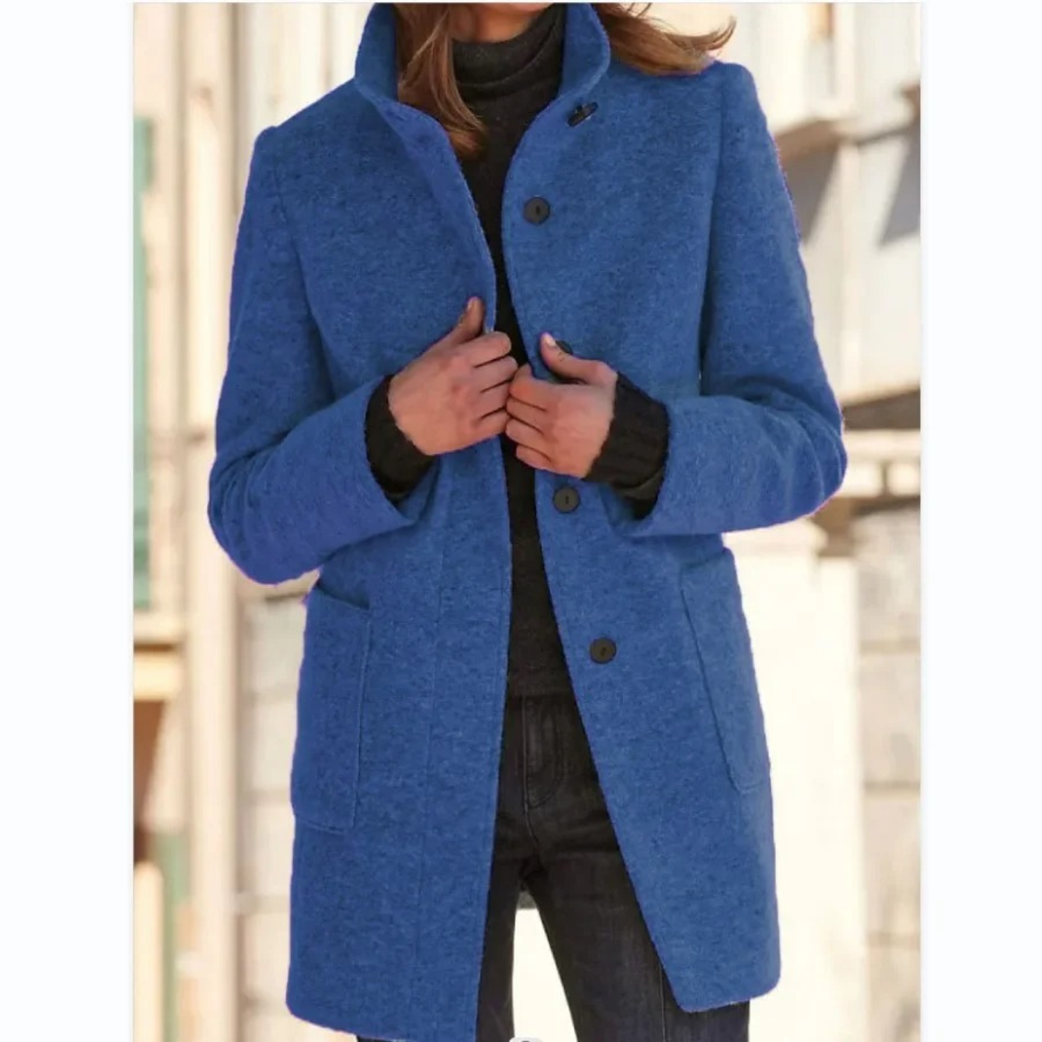 Women’s blue stand-collar winter coat with button front and side pockets.
