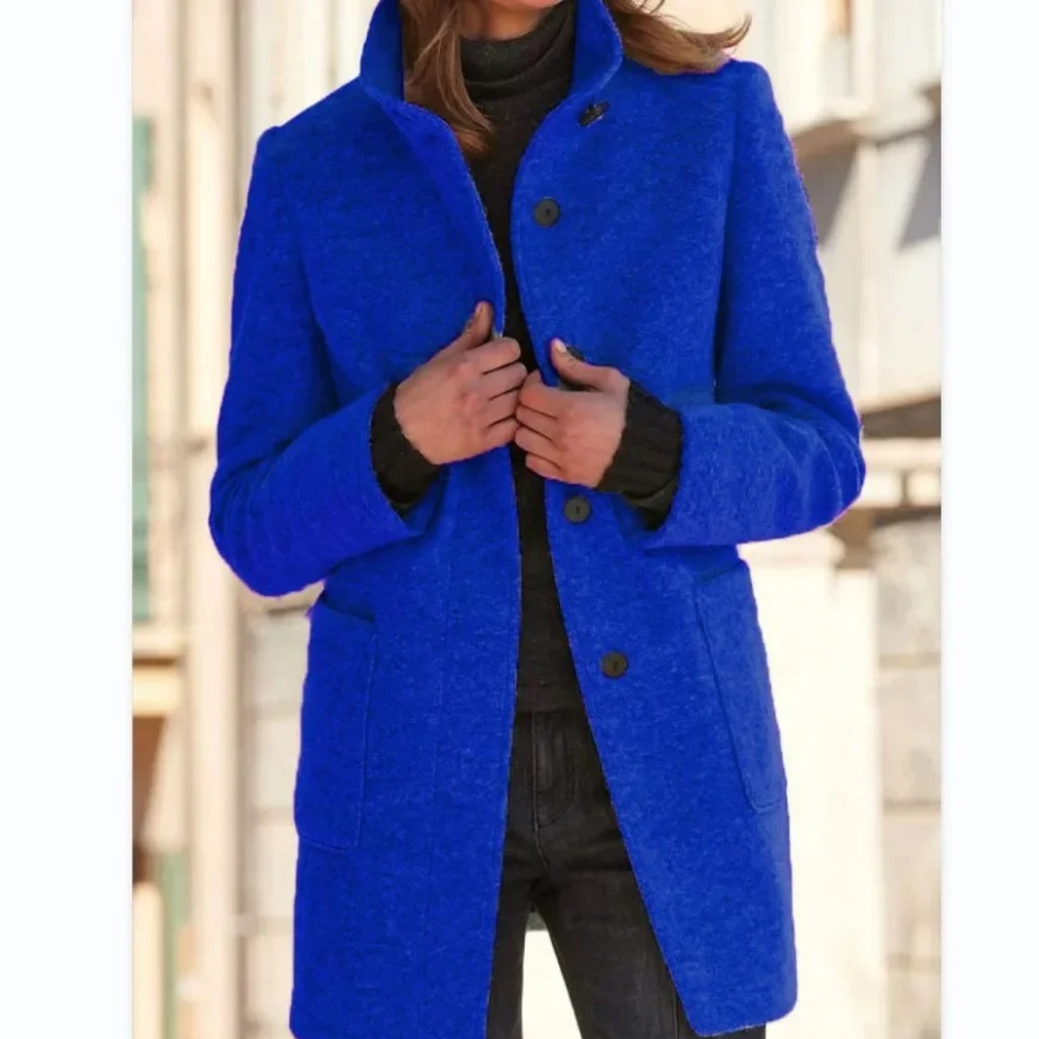 Women’s royal blue stand-collar winter coat with button front and side pockets.