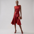 Red sleeveless asymmetric draped midi dress with waist knot and layered ruffle hem