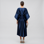 Navy cape-sleeve maxi dress with draped knot detail at back