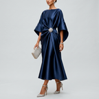 Navy satin cape-sleeve maxi dress with draped waist and silver crystal brooch