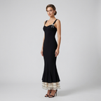 Black fitted fishtail midi dress with spaghetti straps and layered ruffle hem