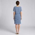 Women's layered chiffon midi dress in blue, back view, short sleeves, layered ruffles