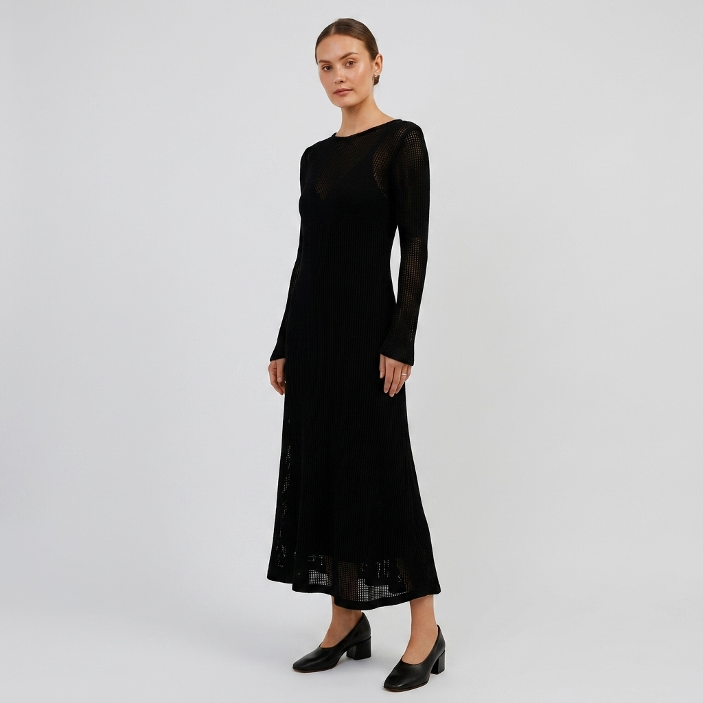 Black sheer knit maxi dress with long sleeves and flared layered hem