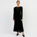 Black sheer knit maxi dress with long sleeves, V-neck, and layered skirt