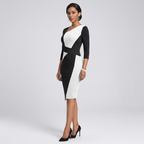 Women’s midi dress with angled neckline, black and white sculpted panel, 3/4 sleeves.