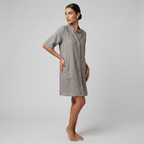 Grey shirt dress with button front, relaxed midi fit, and side pockets