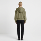 Women's zip-front cropped hoodie in olive green, back view with hood and drawstring