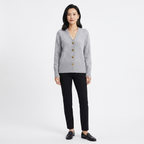 Grey knit V-neck cardigan with gold heart buttons; relaxed fit layered sweater
