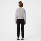 Back view of grey knit V-neck cardigan with gold heart button detail