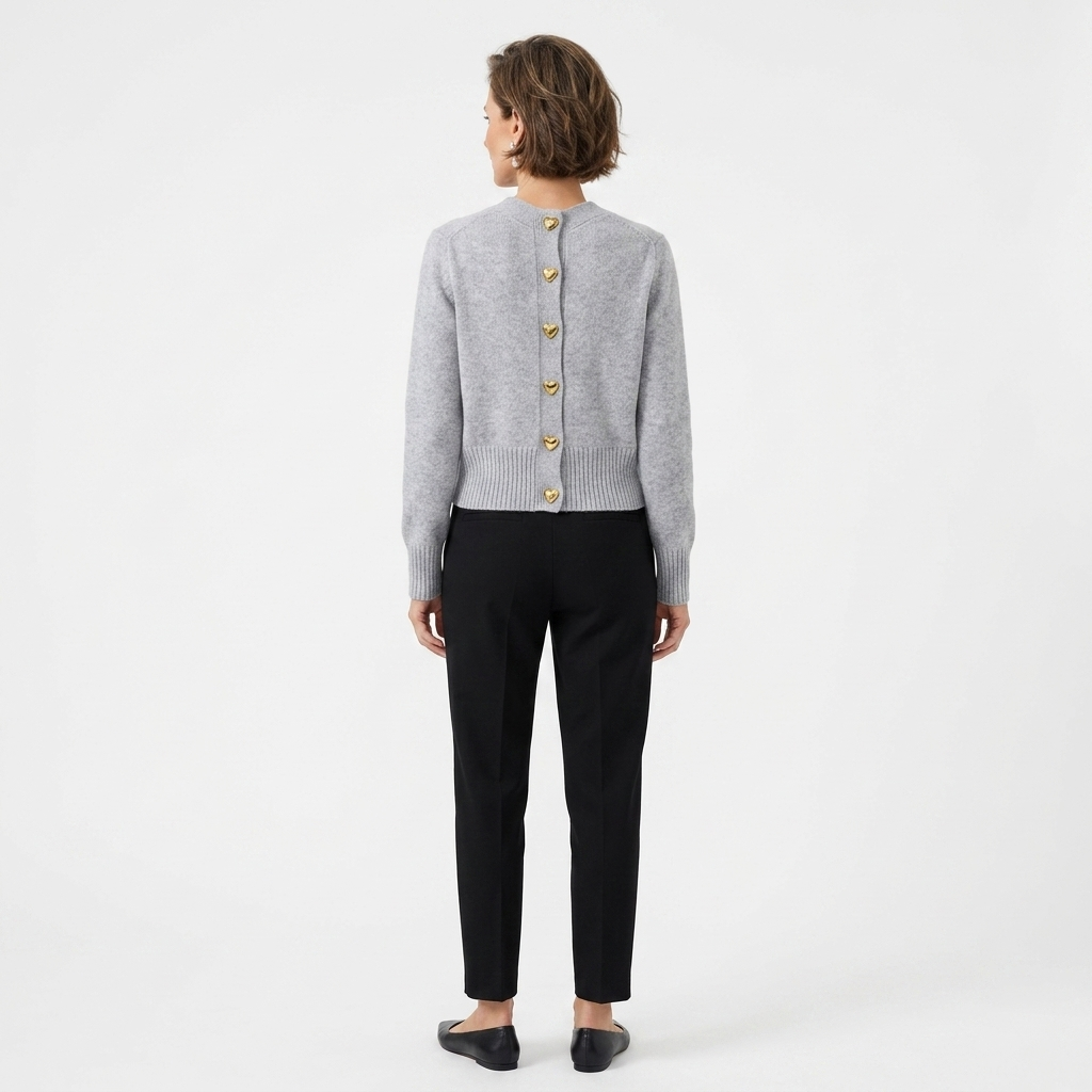 Back view of grey knit V-neck cardigan with gold heart button detail