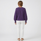 Women's dark purple cable knit pullover sweater, back view with textured stitch pattern.