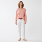 Light pink boat-neck knit sweater with long sleeves, relaxed draped fit