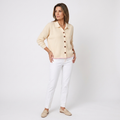 Beige knit button-front cardigan with pointed collar and long sleeves