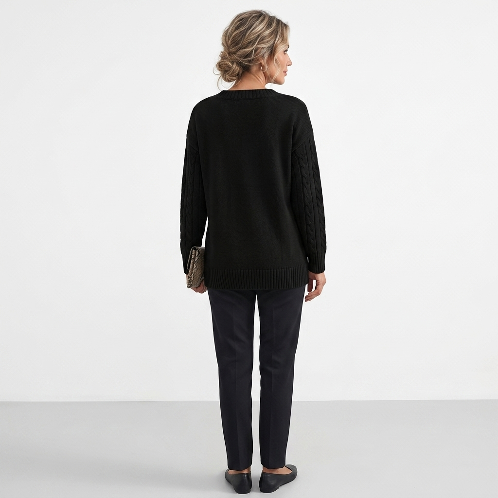 Black cashmere knit sweater back view with ribbed crew neck and balloon sleeves