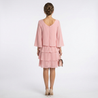 Women's pink ruffle A-line midi dress, back view, layered tiers with three-quarter sleeves