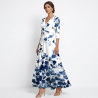 Women’s wrap maxi dress with V-neck, three-quarter sleeves, white base with blue floral design