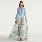 Light blue V-neck maxi dress with long sleeves and flowing blue floral print skirt.