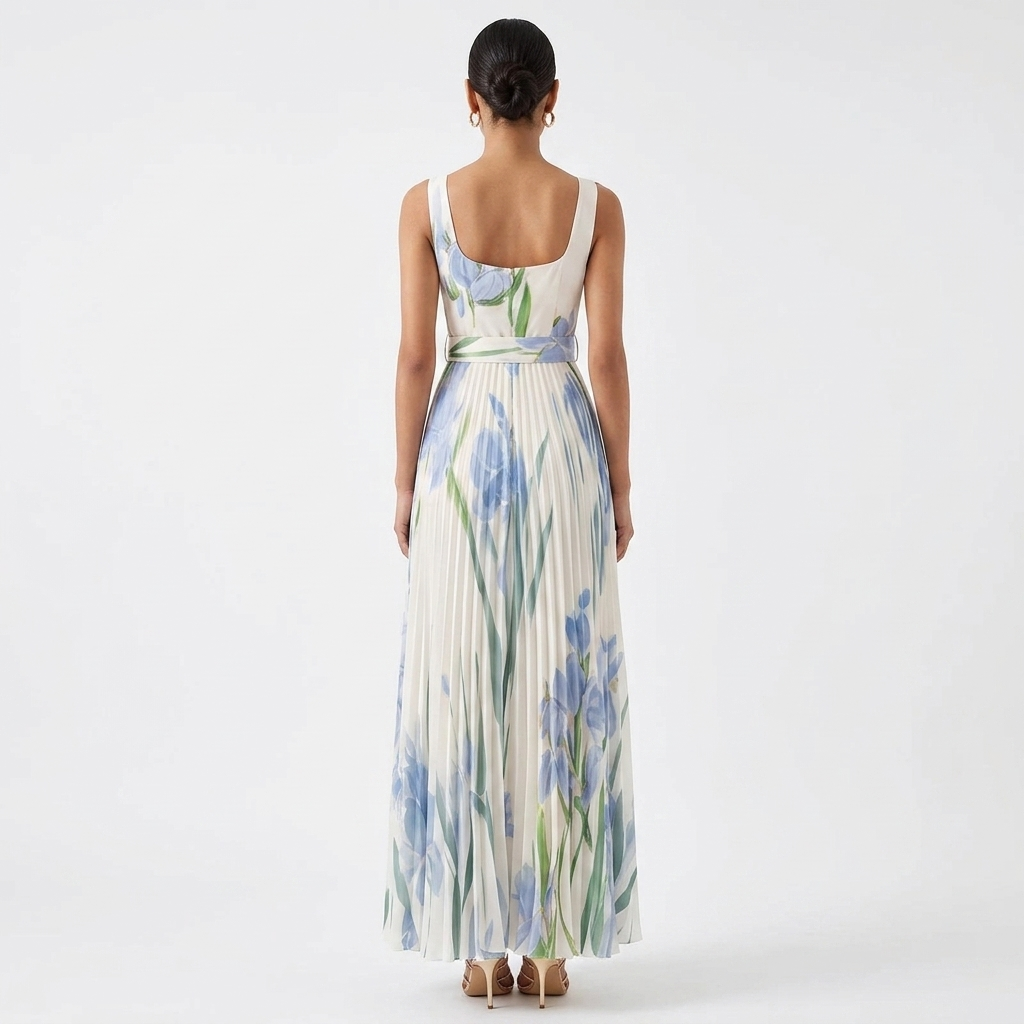Back view of floral pleated maxi dress with blue and green botanical print, square neckline